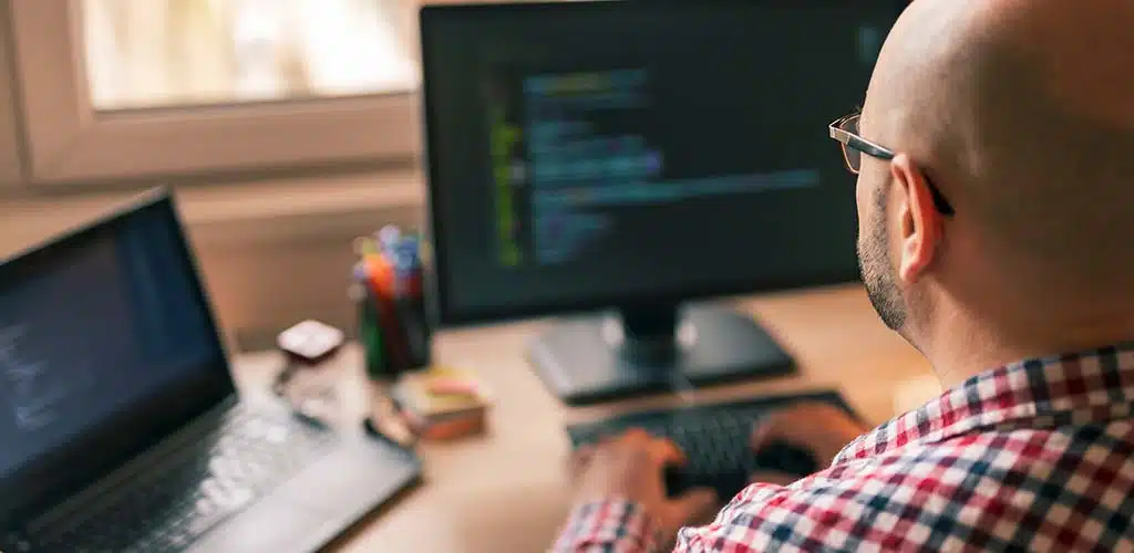 Software Developer sitting on Desk
