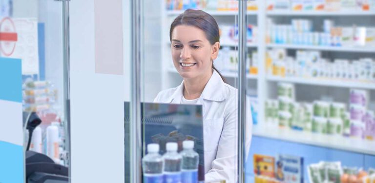 Pharmacist standing at the counter in the pharmacy