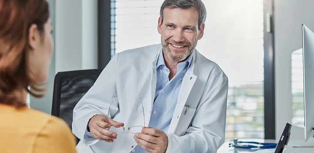 Physicians talking to patient