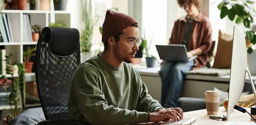 Young man in front of a computer
