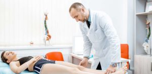 Physical therapist with woman