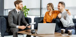 Young couple with financial advisor in office