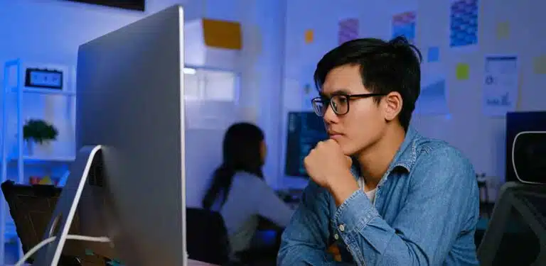 Man programming on computer an learn