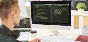 Man programming on computer