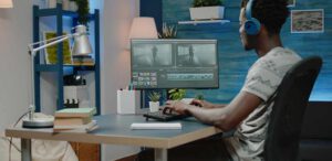 Man working as videographer editing video montage